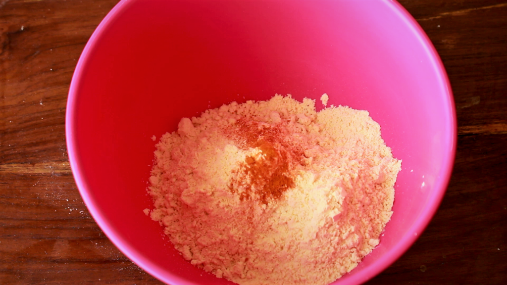 Added salt and turmeric powder to sifted gram flour
